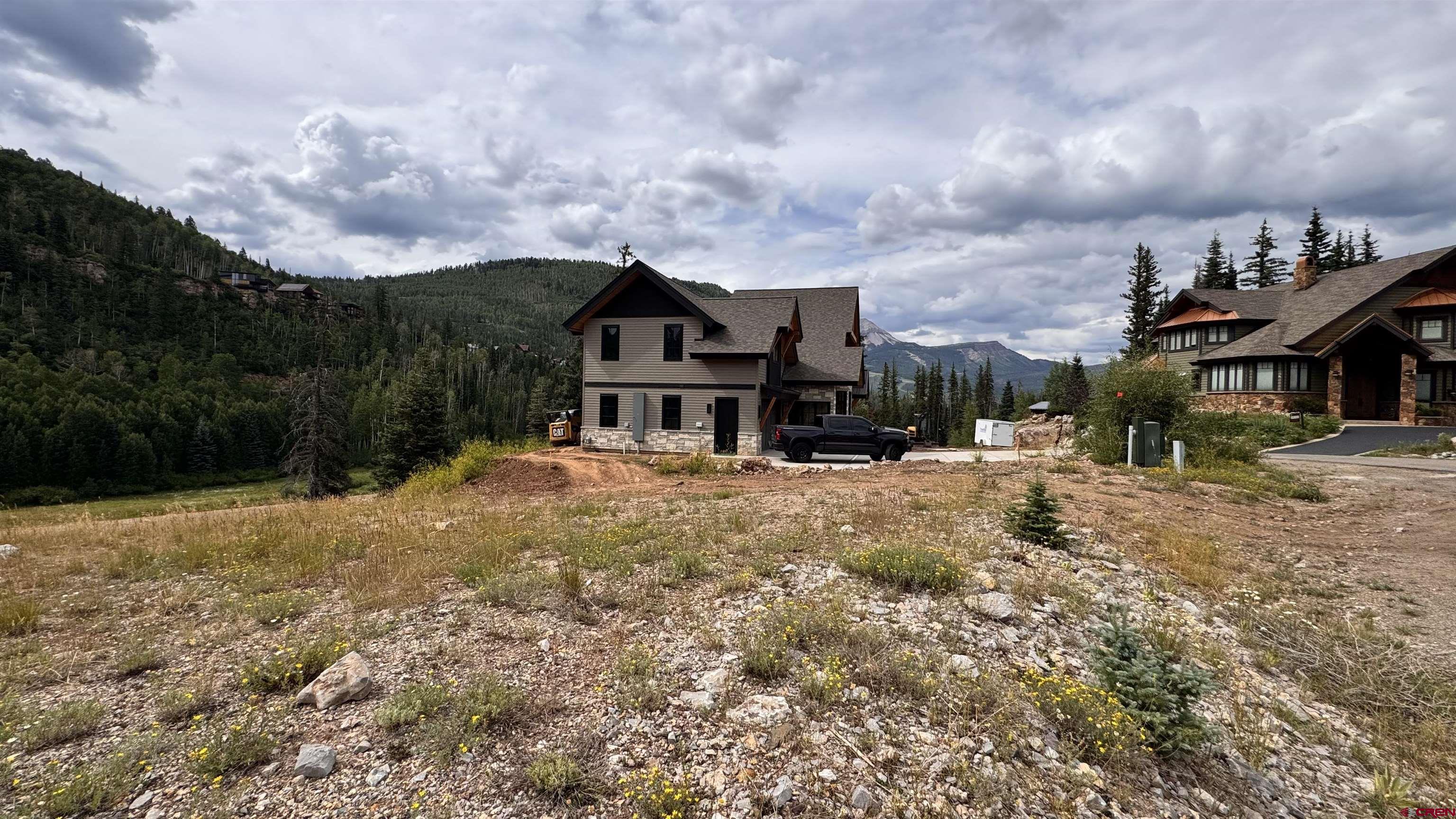 85 Vermillion Drive Durango, CO 81301 - Photo 16 of 21 a front view of a house with a yard and garage