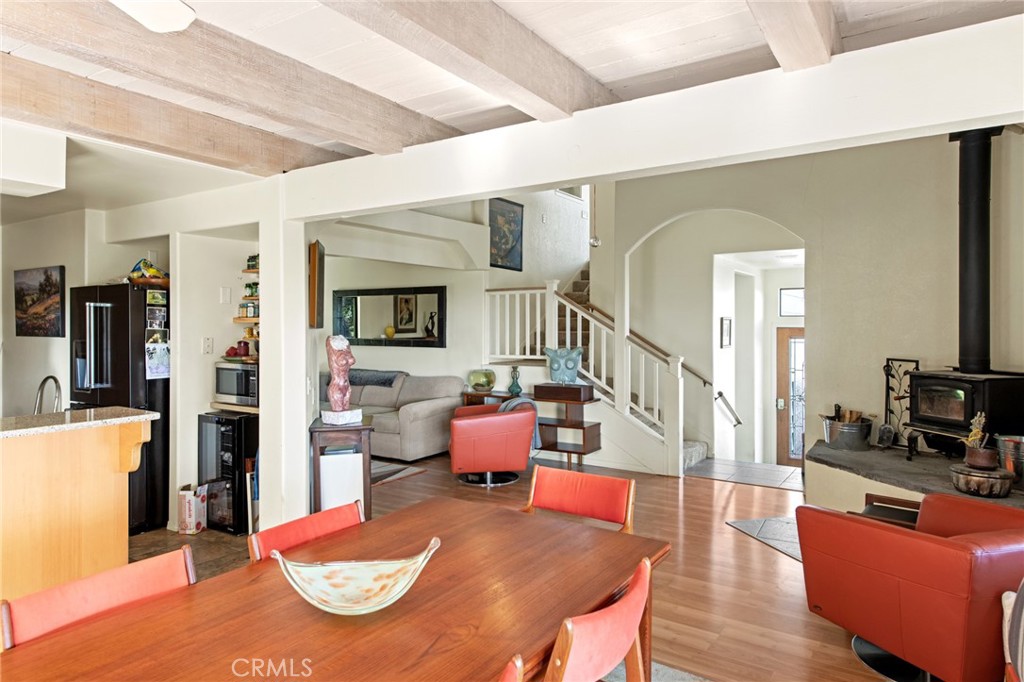 8255 Balboa Road Atascadero, CA 93422 - Photo 20 of 72 a living room with furniture kitchen view and a wooden floor