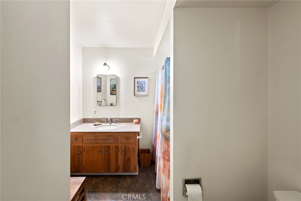 8255 Balboa Road Atascadero, CA 93422 - Photo 26 of 72 a bathroom with a sink and a mirror