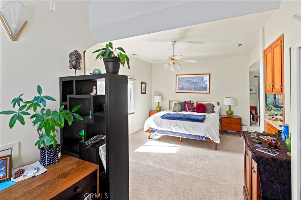 8255 Balboa Road Atascadero, CA 93422 - Photo 27 of 72 a bedroom with a bed and a potted plant
