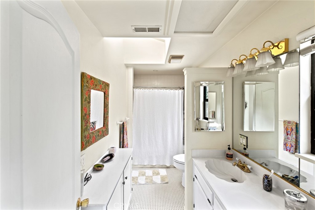 8255 Balboa Road Atascadero, CA 93422 - Photo 30 of 72 a bathroom with a sink mirror and vanity