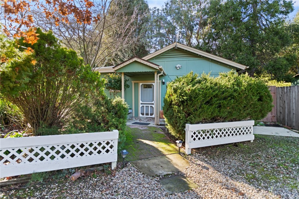 8255 Balboa Road Atascadero, CA 93422 - Photo 53 of 72 a view of a wooden house with a yard and wooden fence