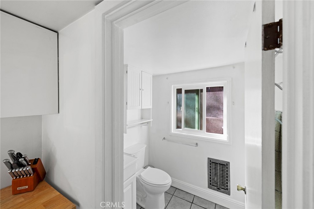 8255 Balboa Road Atascadero, CA 93422 - Photo 56 of 72 a bathroom with a toilet sink and a mirror