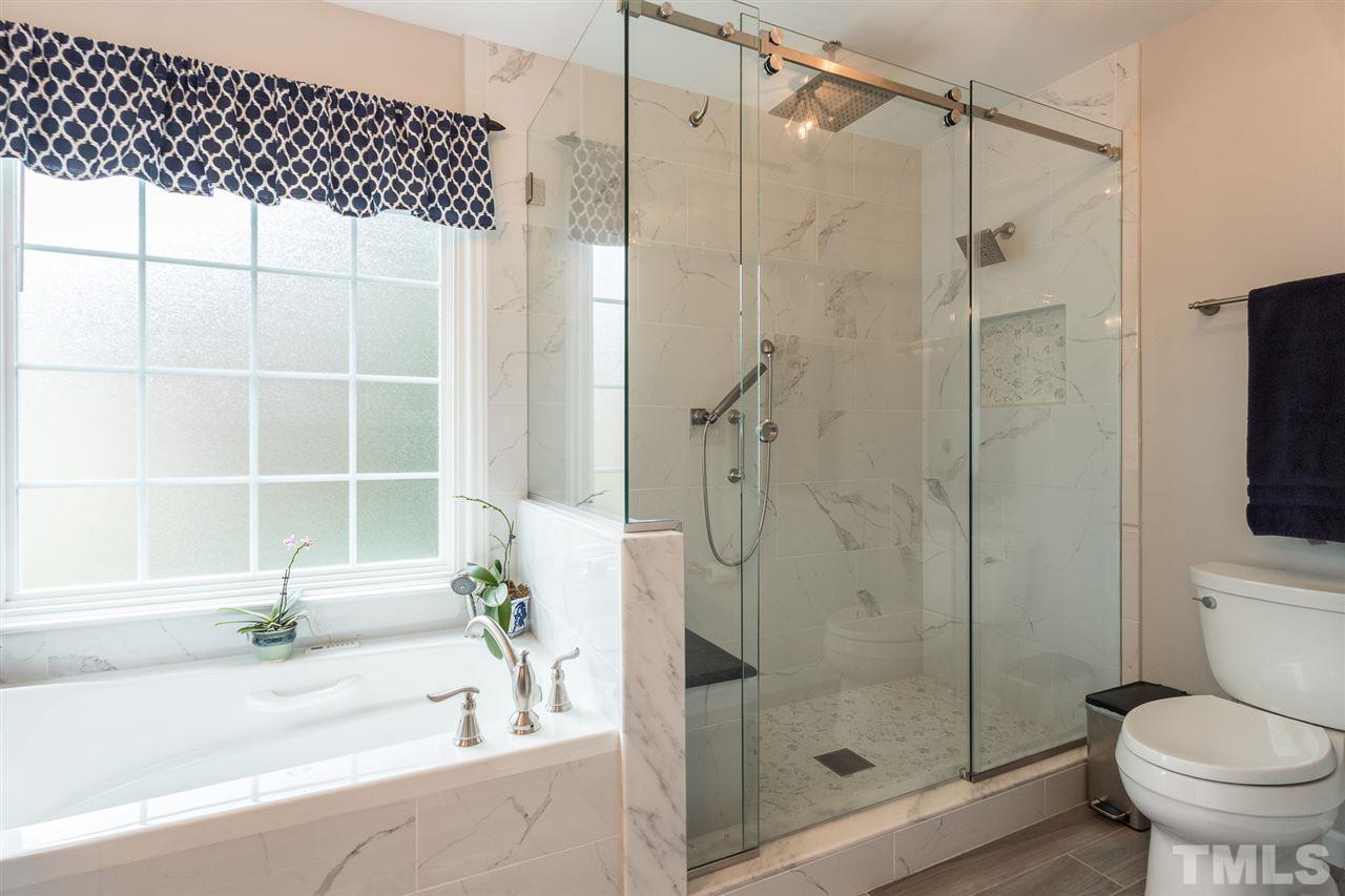 1705 Waltham Way Raleigh, NC 27614 - Photo 22 of 30 a bathroom with a shower and a toilet