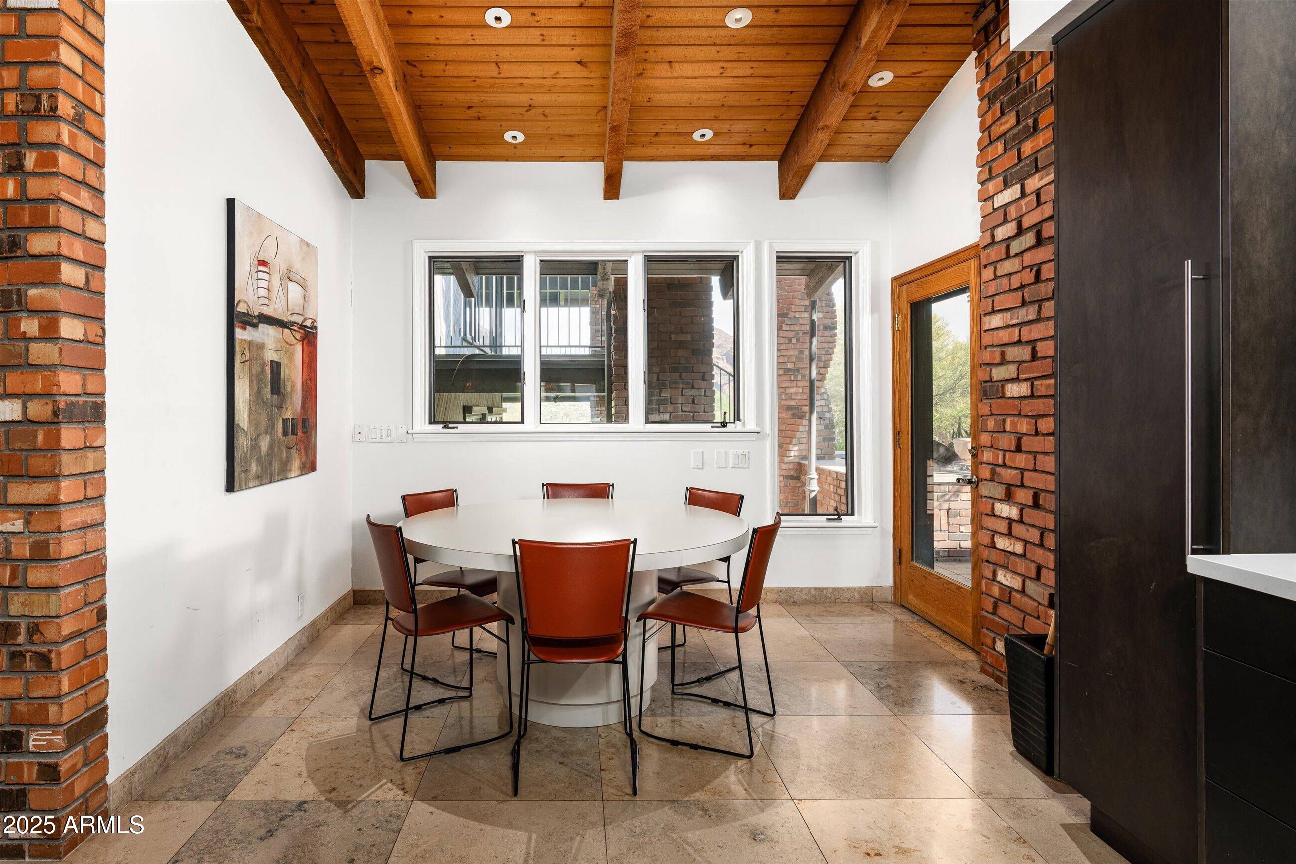 6830 North 46th Place Paradise Valley, AZ 85253 - Photo 15 of 65 a view of a dining room with furniture and chandelier
