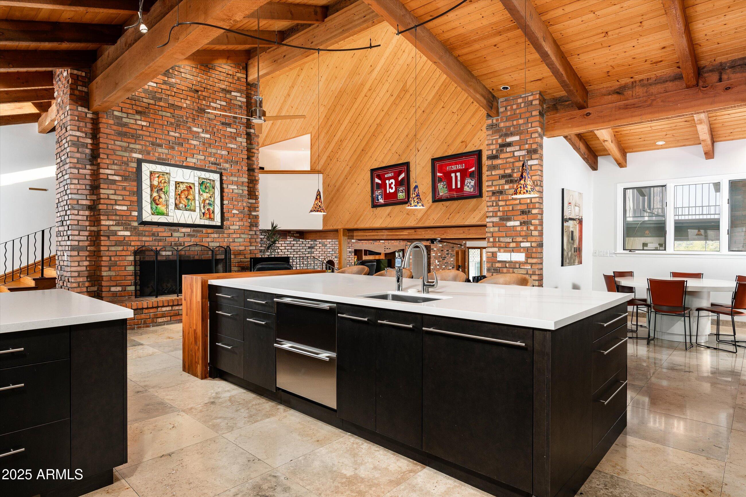 6830 North 46th Place Paradise Valley, AZ 85253 - Photo 16 of 65 a kitchen with a sink and a stove top oven