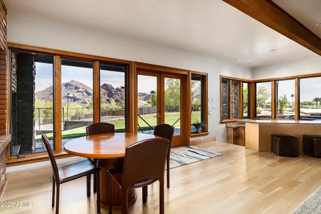 a dining room with furniture and a chandelier