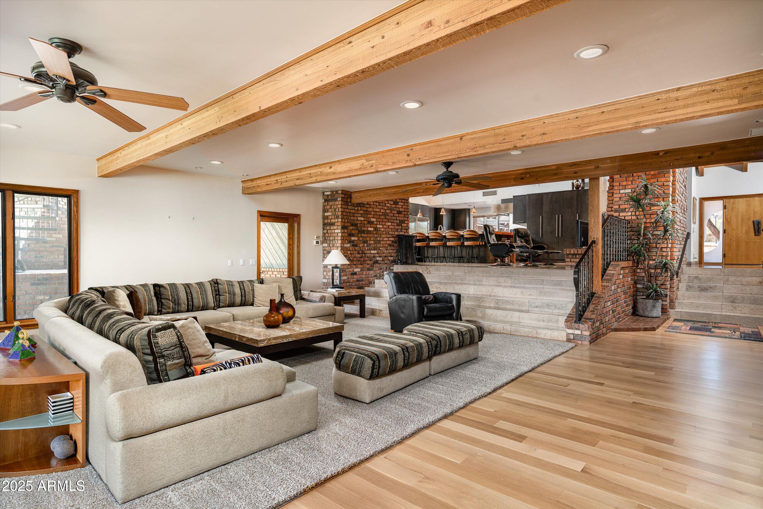 6830 North 46th Place Paradise Valley, AZ 85253 - Photo 18 of 65 a living room with furniture and a wooden floor