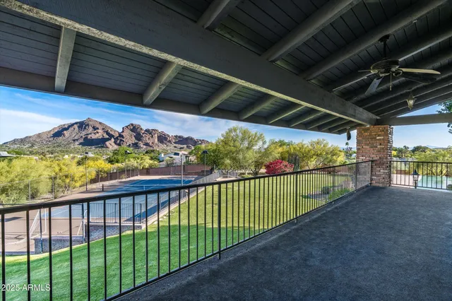 a room with furniture pool table and window