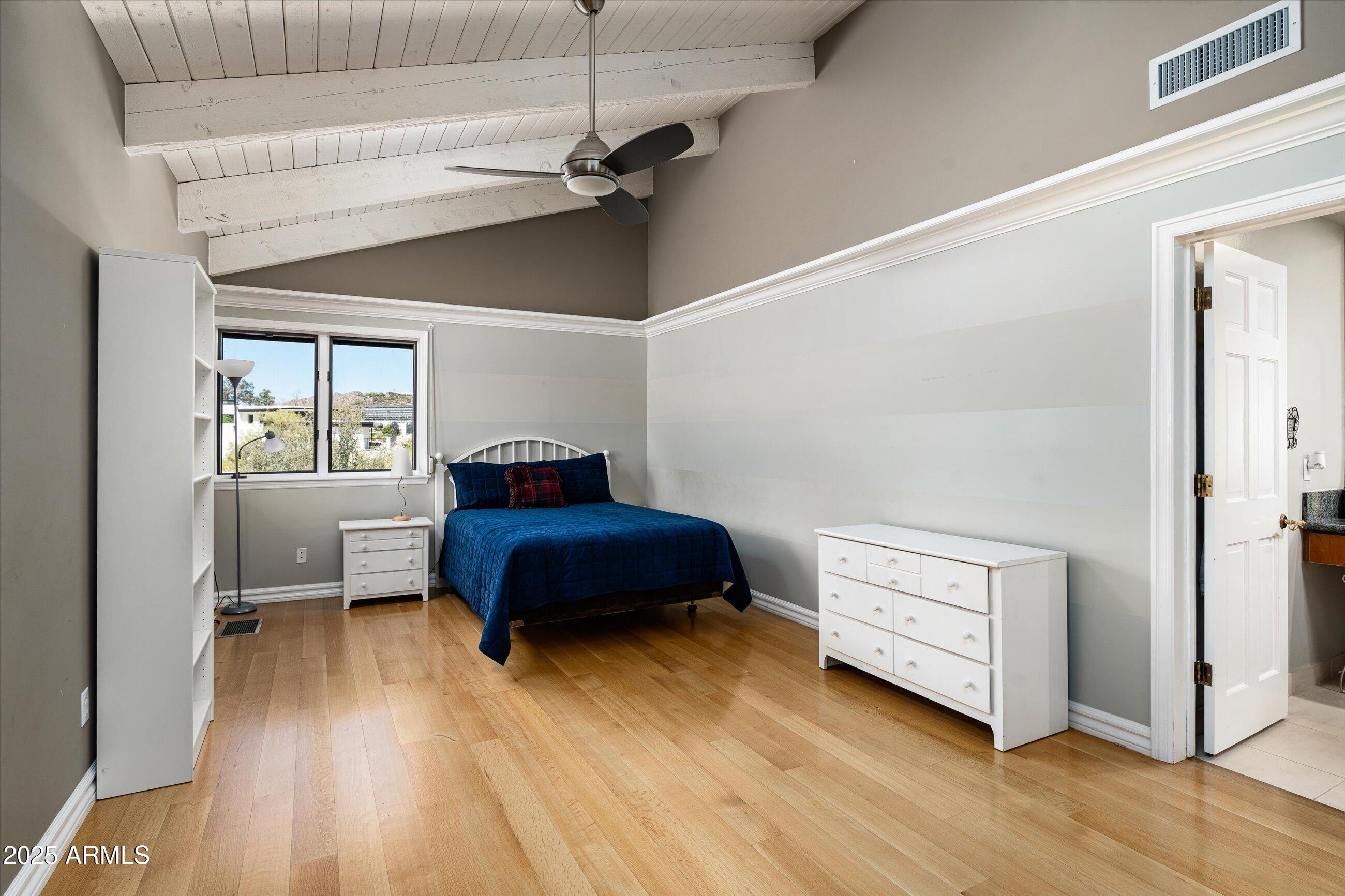 6830 North 46th Place Paradise Valley, AZ 85253 - Photo 28 of 65 a bedroom with a bed and a window