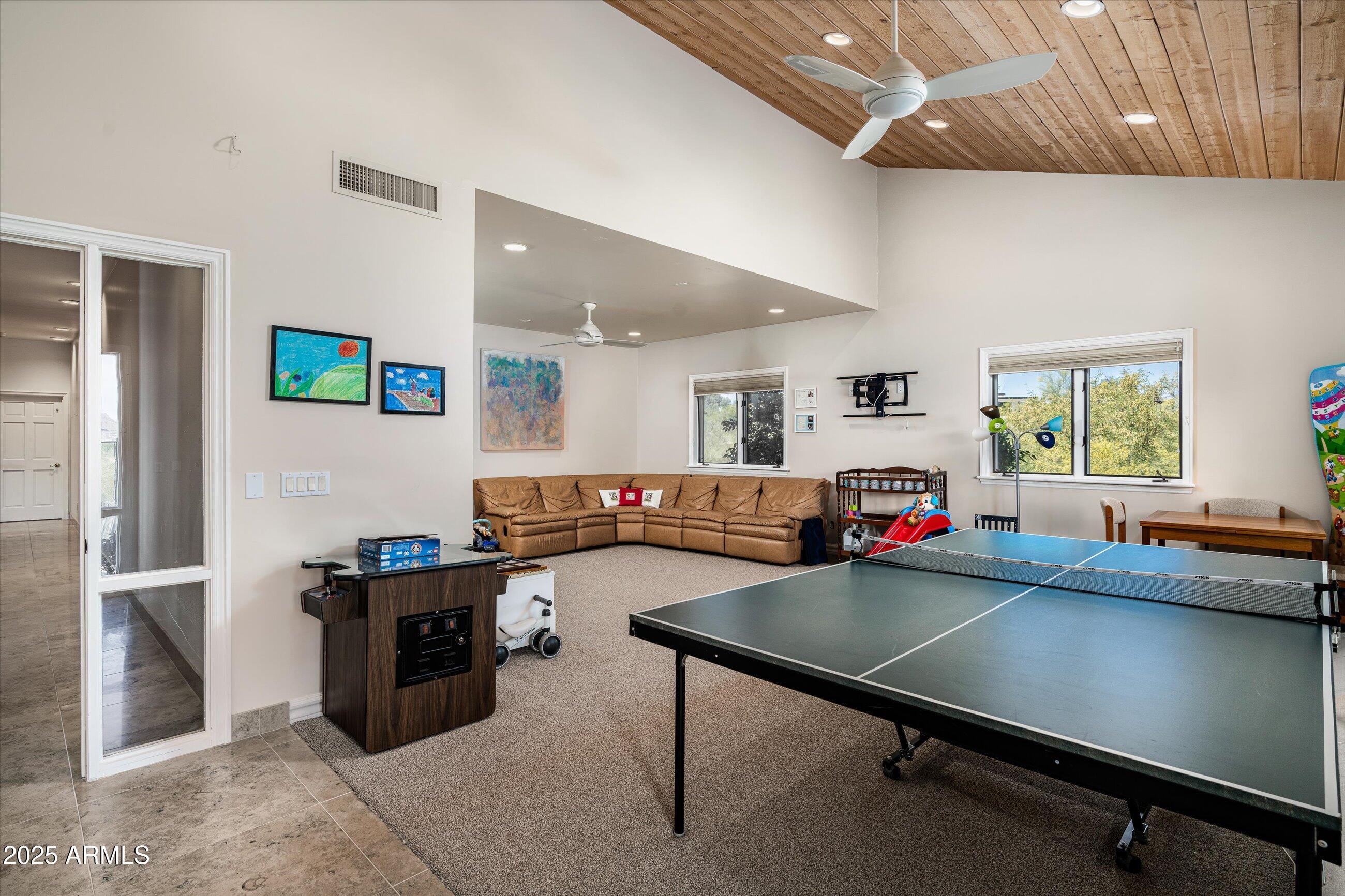 6830 North 46th Place Paradise Valley, AZ 85253 - Photo 32 of 65 a room with furniture pool table and window