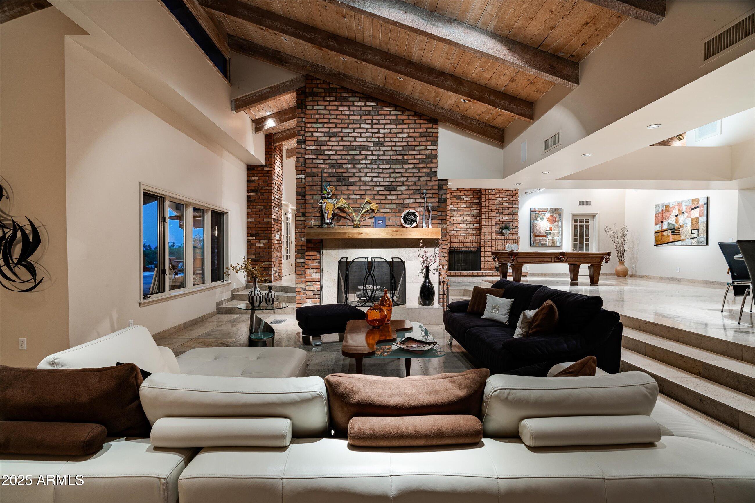 6830 North 46th Place Paradise Valley, AZ 85253 - Photo 35 of 65 a living room with furniture and a fireplace