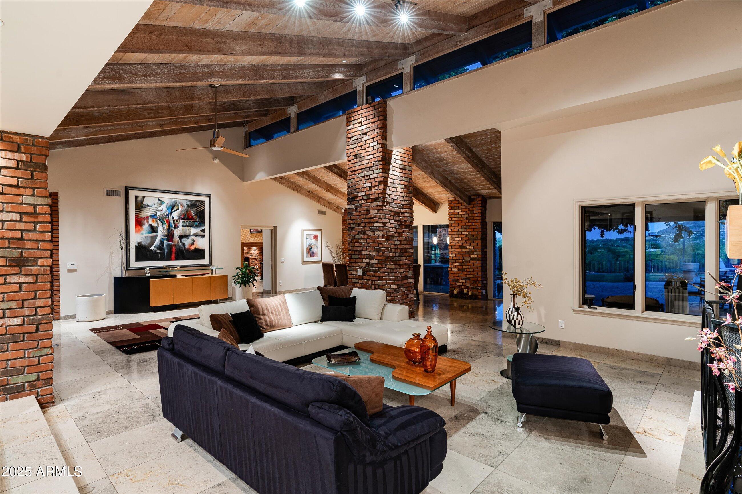 6830 North 46th Place Paradise Valley, AZ 85253 - Photo 36 of 65 a living room with furniture and a large window