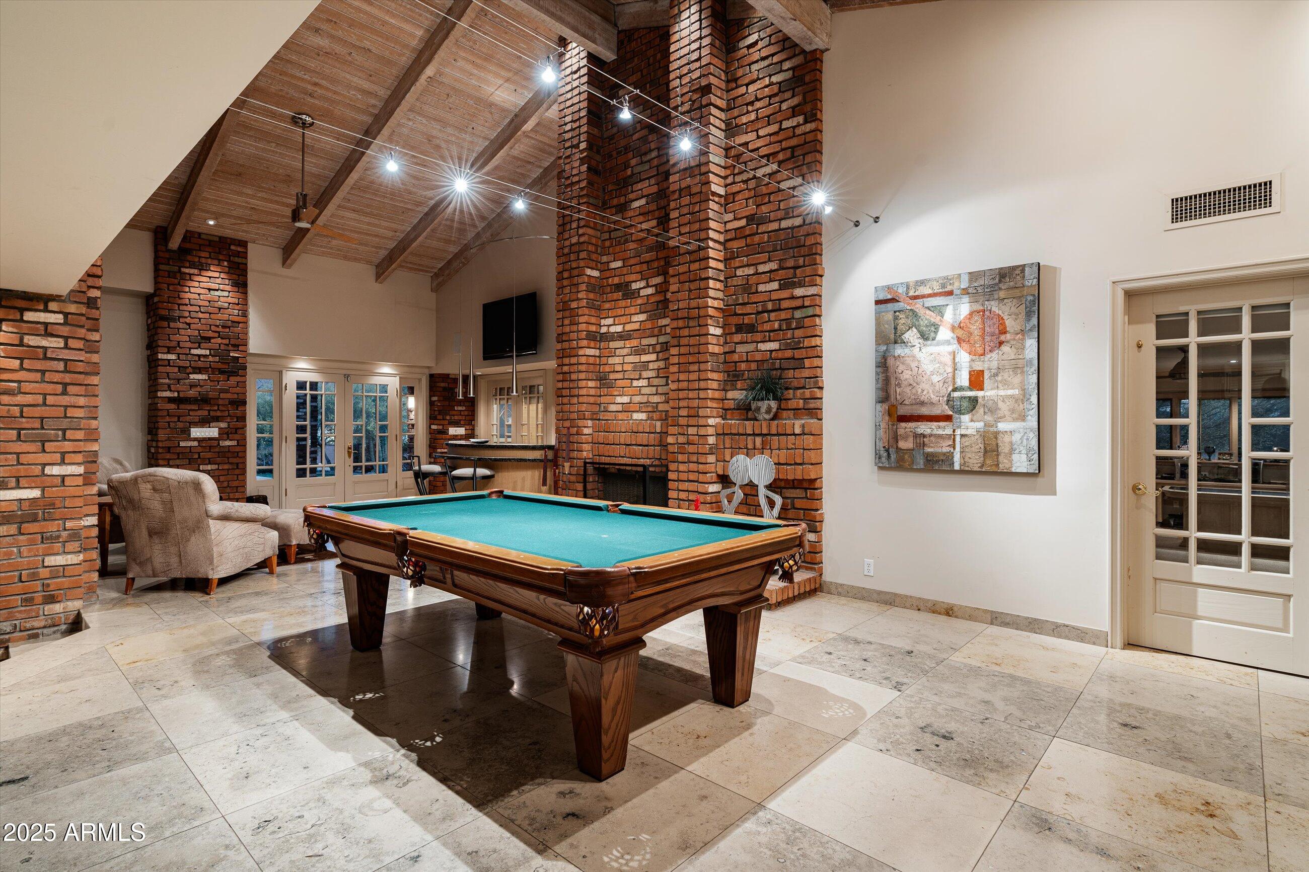 6830 North 46th Place Paradise Valley, AZ 85253 - Photo 37 of 65 a room with furniture pool table and windows