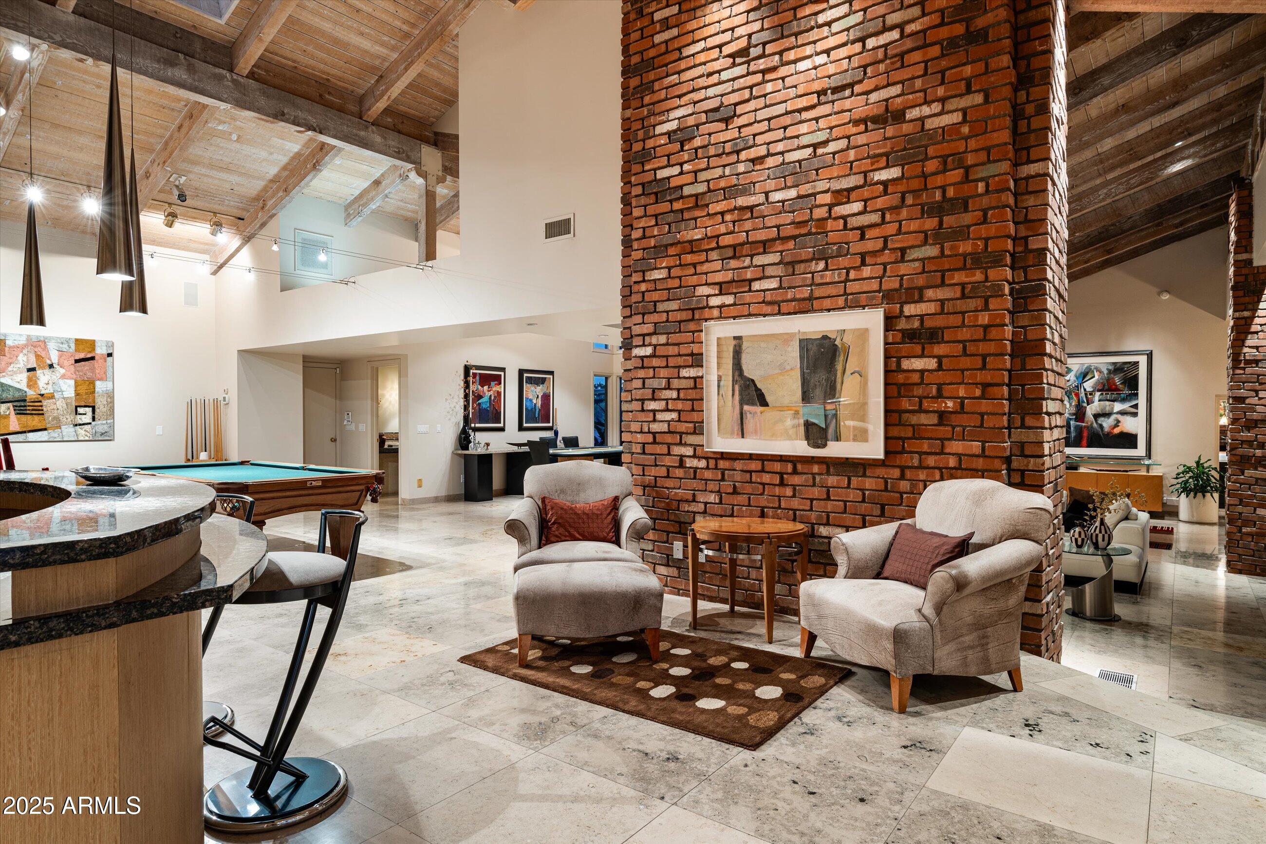 6830 North 46th Place Paradise Valley, AZ 85253 - Photo 39 of 65 a living room with furniture chess board and a fireplace