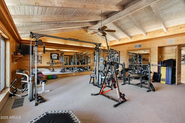 a view of a house with sitting area and swimming pool