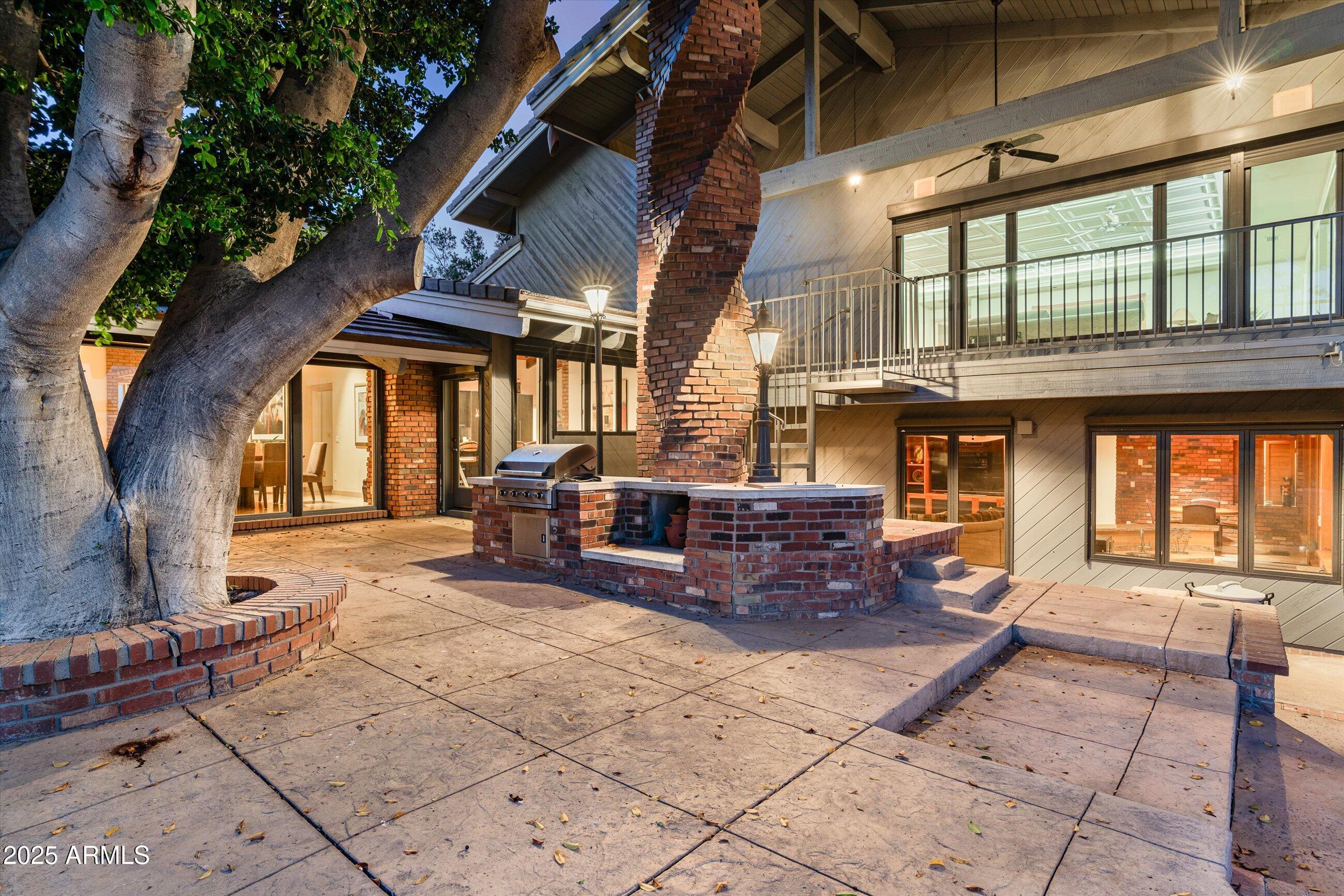 6830 North 46th Place Paradise Valley, AZ 85253 - Photo 48 of 65 a living room filled with furniture window and a table and chairs