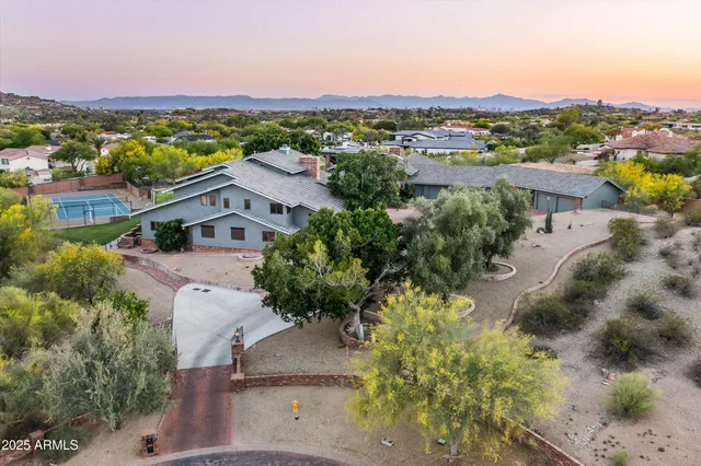 a kitchen with stainless steel appliances kitchen island a table and chairs