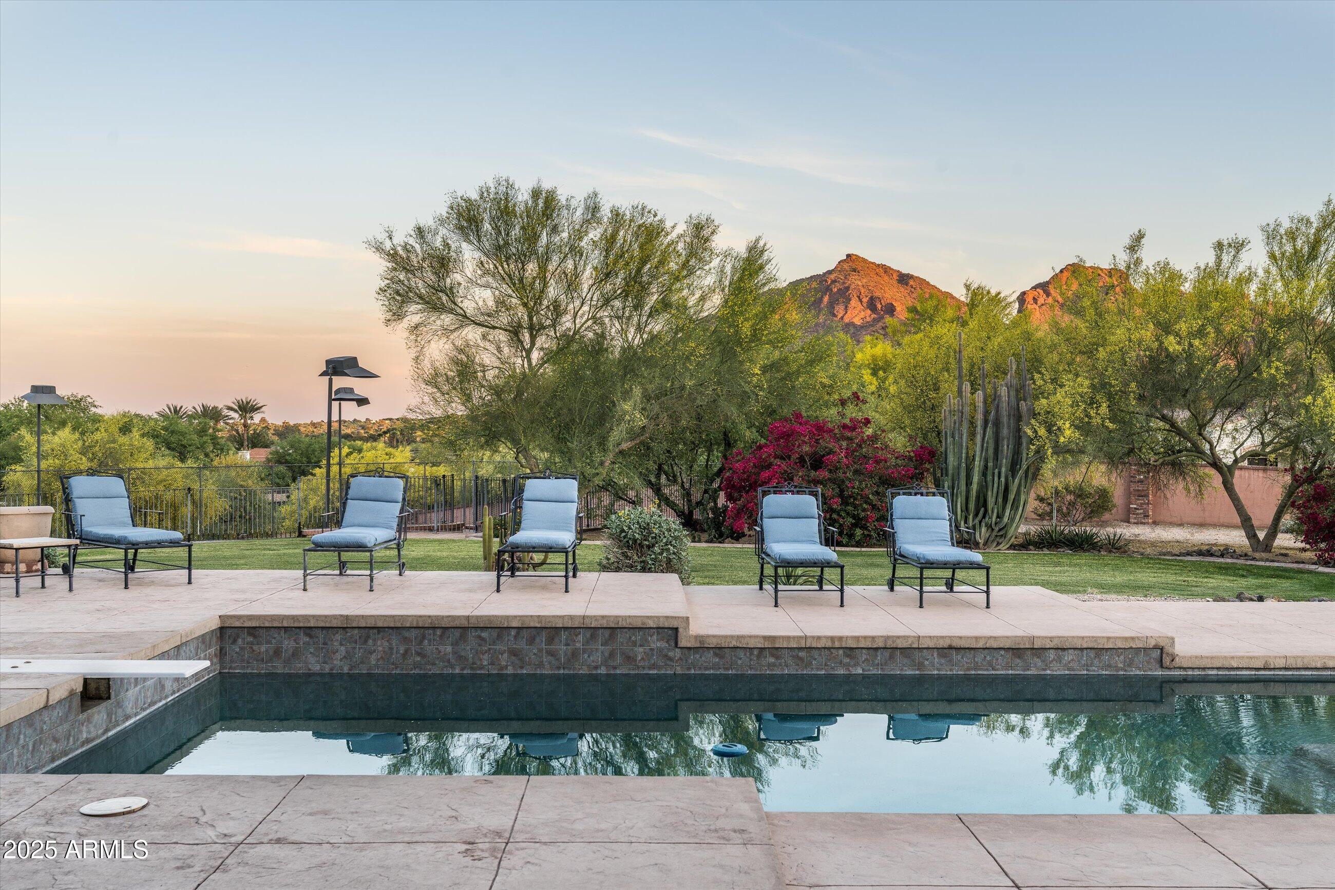 6830 North 46th Place Paradise Valley, AZ 85253 - Photo 52 of 65 a view of a swimming pool and a patio