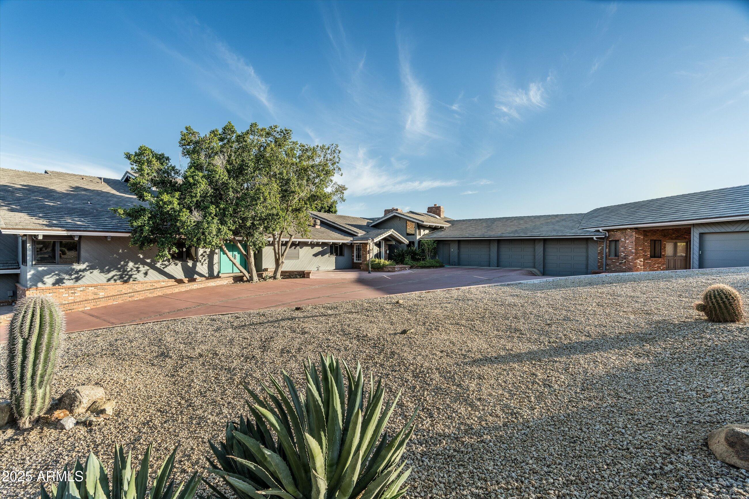 6830 North 46th Place Paradise Valley, AZ 85253 - Photo 6 of 65 a view of a house with a yard