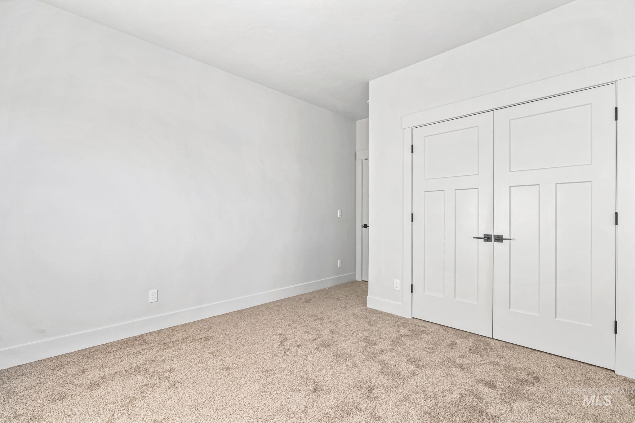 2905 Cypress Point Payette, ID 83661 - Photo 20 of 26 Unfurnished bedroom featuring carpet floors and a closet