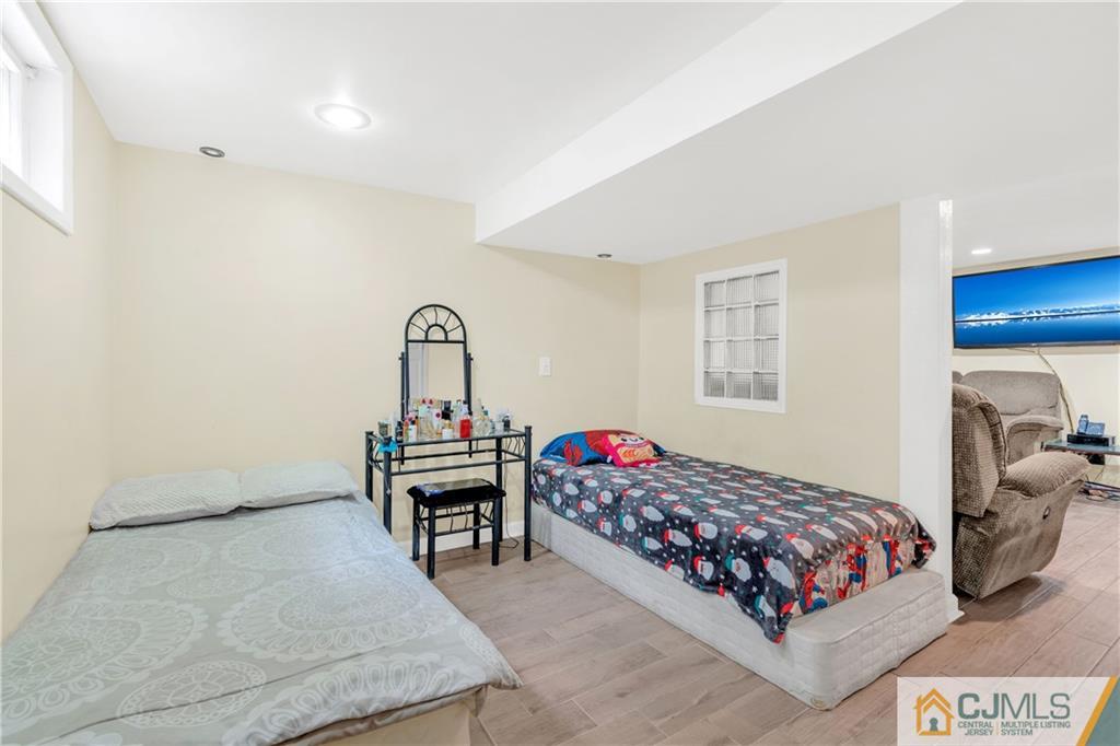 208 Oak Place Piscataway, NJ 08854 - Photo 13 of 23 a bedroom with a bed and window