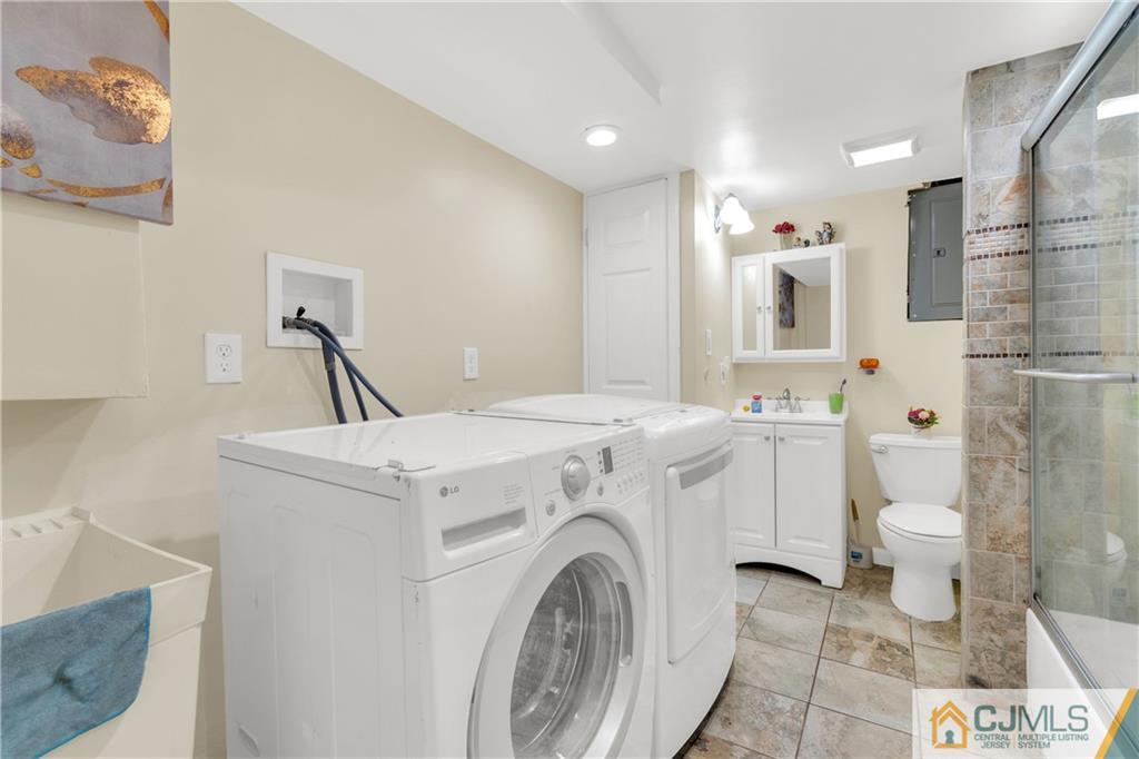 208 Oak Place Piscataway, NJ 08854 - Photo 16 of 23 a view of bathroom with a sink and a toilet