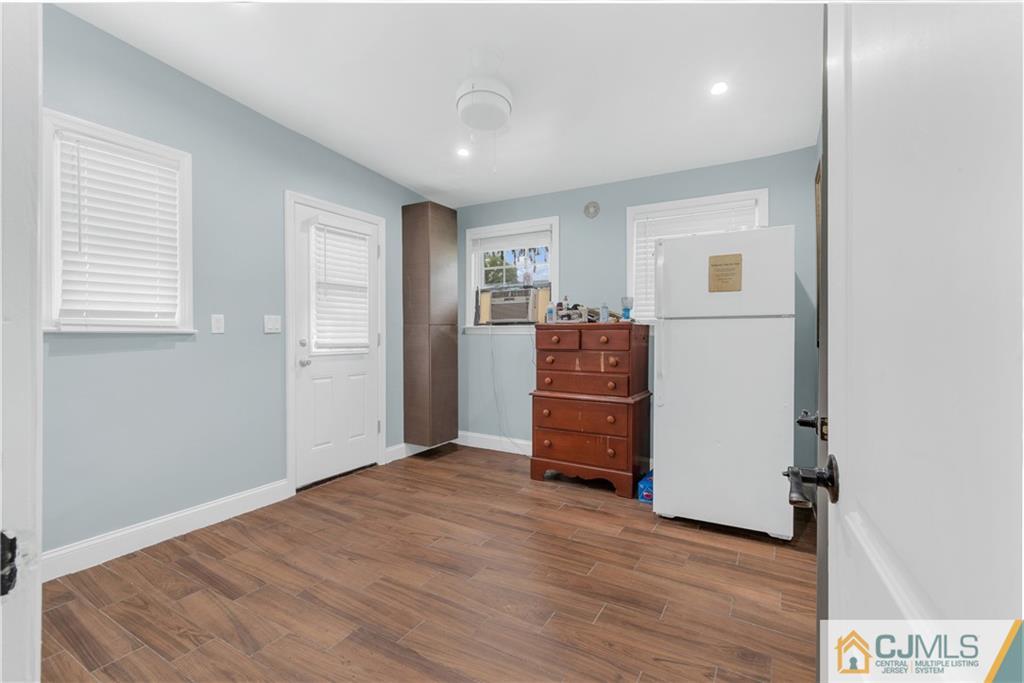 208 Oak Place Piscataway, NJ 08854 - Photo 18 of 23 a view of empty room with wooden floor