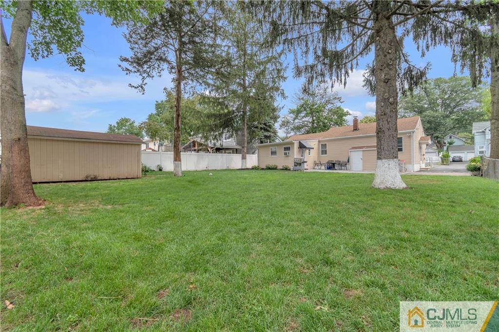 208 Oak Place Piscataway, NJ 08854 - Photo 2 of 23 a view of a house with a yard
