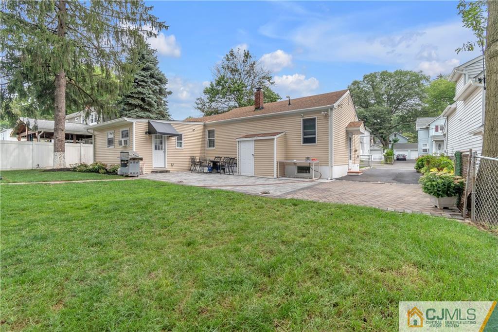 208 Oak Place Piscataway, NJ 08854 - Photo 21 of 23 a backyard of a house with table and chairs