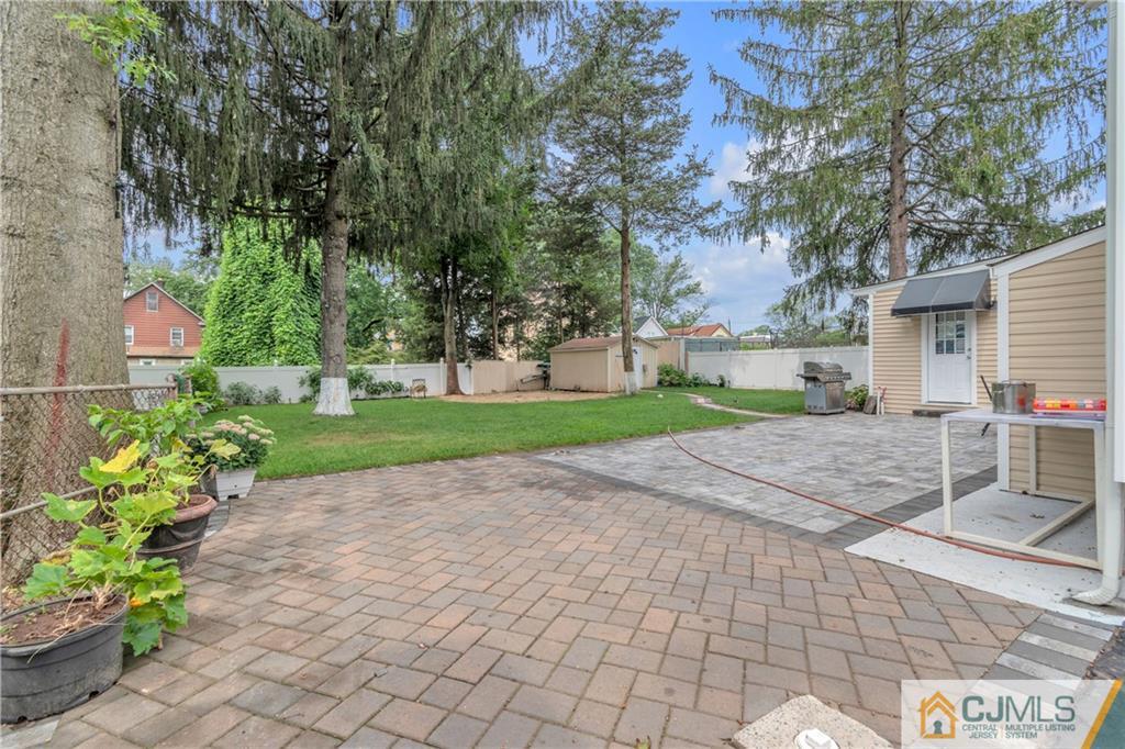 208 Oak Place Piscataway, NJ 08854 - Photo 22 of 23 a view of a garden with a fountain