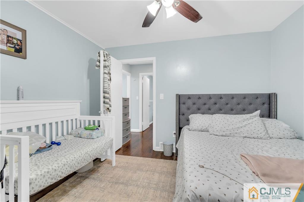 208 Oak Place Piscataway, NJ 08854 - Photo 7 of 23 a bedroom with a bed and a table