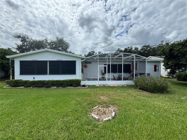 a front view of a house with a garden and porch