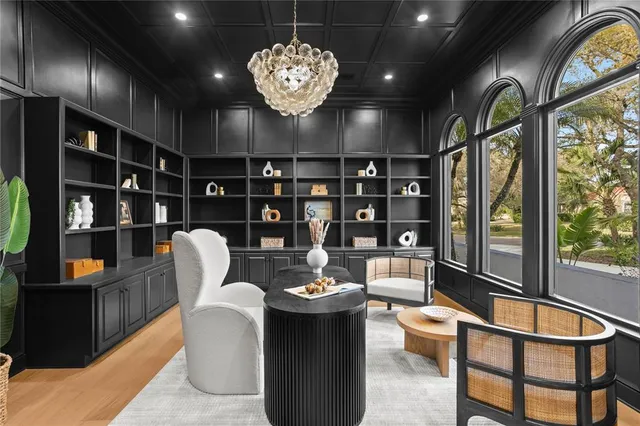 a large white kitchen with a large tub and sink