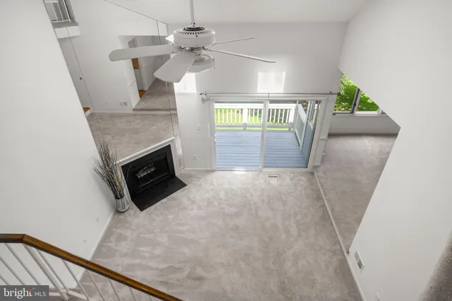 a dining room with furniture a chandelier and wooden floor