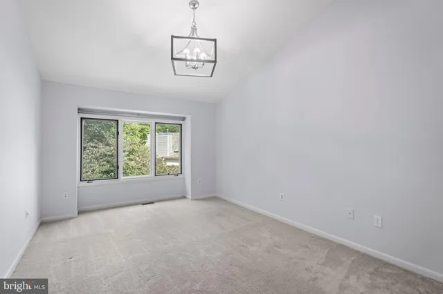 a view of a bathroom from a hallway