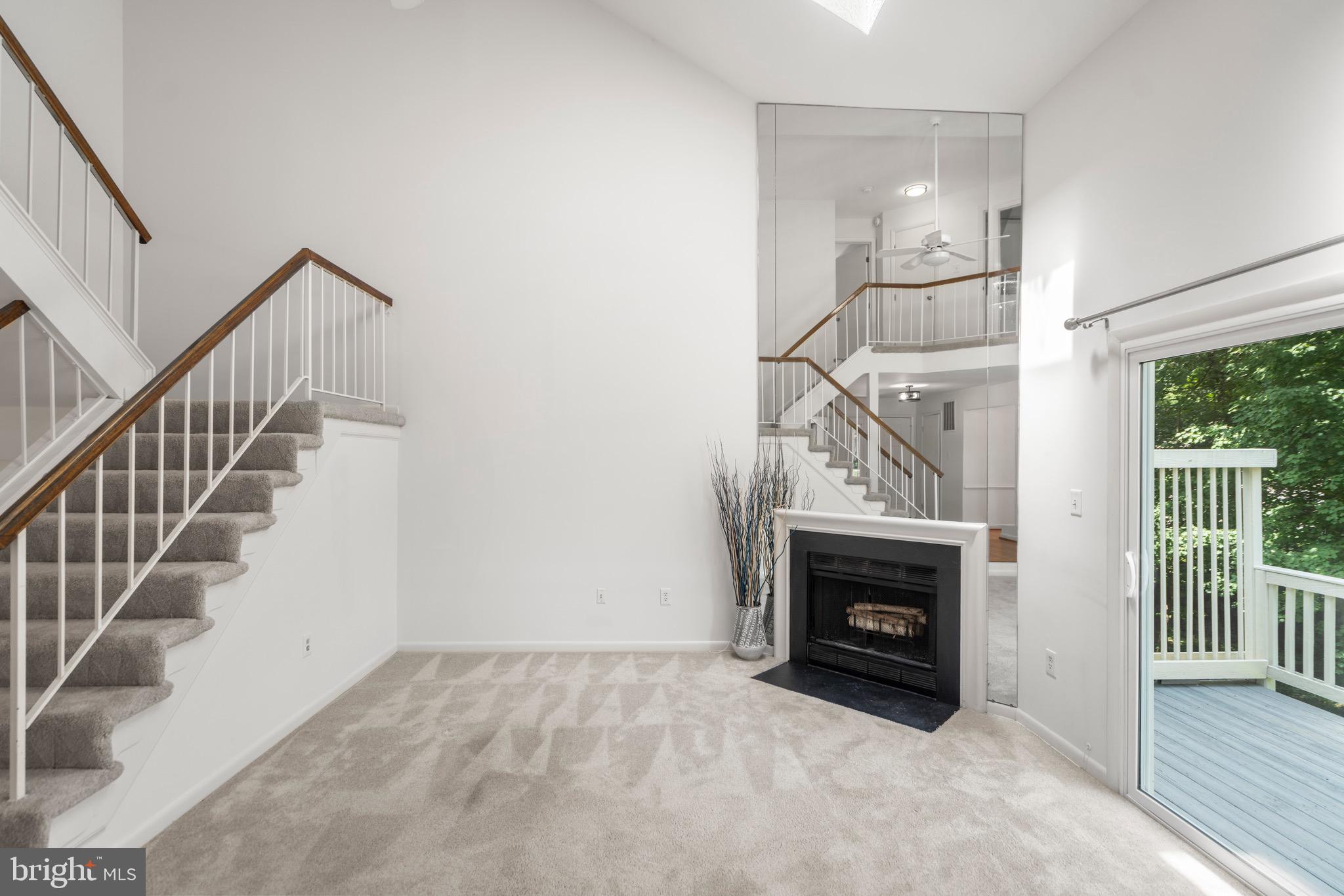 1281 Wedgewood Manor Way Reston, VA 20194 - Photo 3 of 56 Living room view to stairs and fireplace