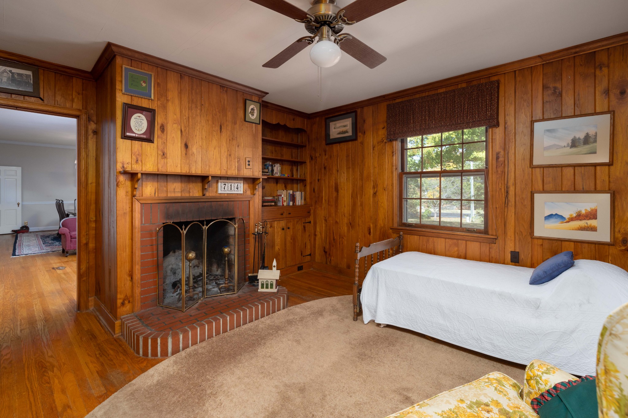 714 Murfreesboro Road Franklin, TN 37064 - Photo 16 of 46 a bedroom with a bed and a fireplace
