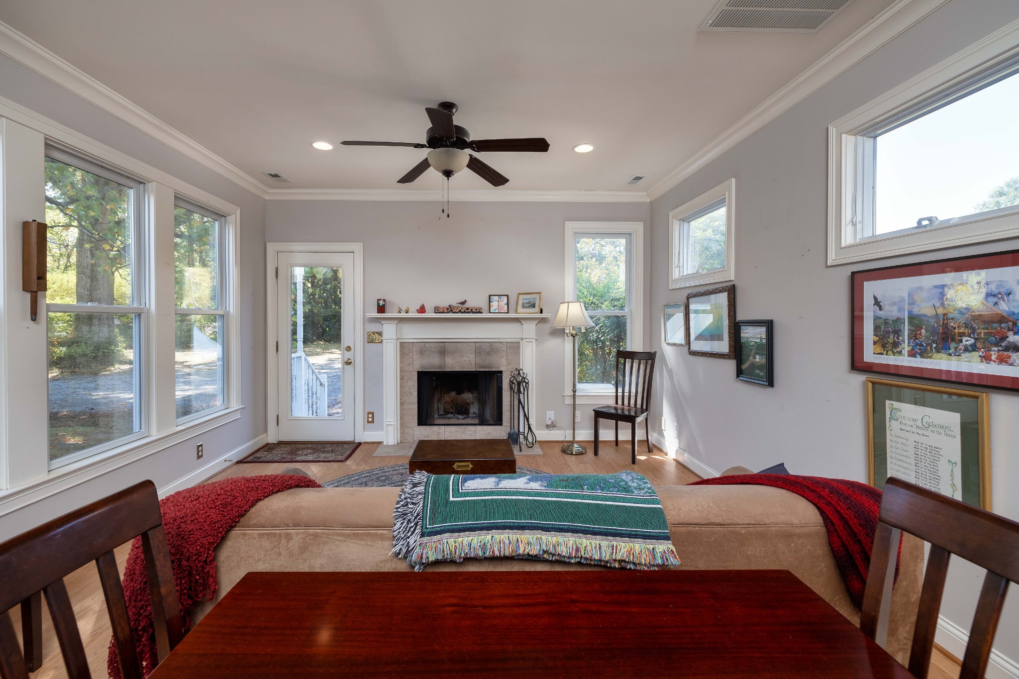 714 Murfreesboro Road Franklin, TN 37064 - Photo 18 of 46 a living room with furniture a fireplace and a floor to ceiling window