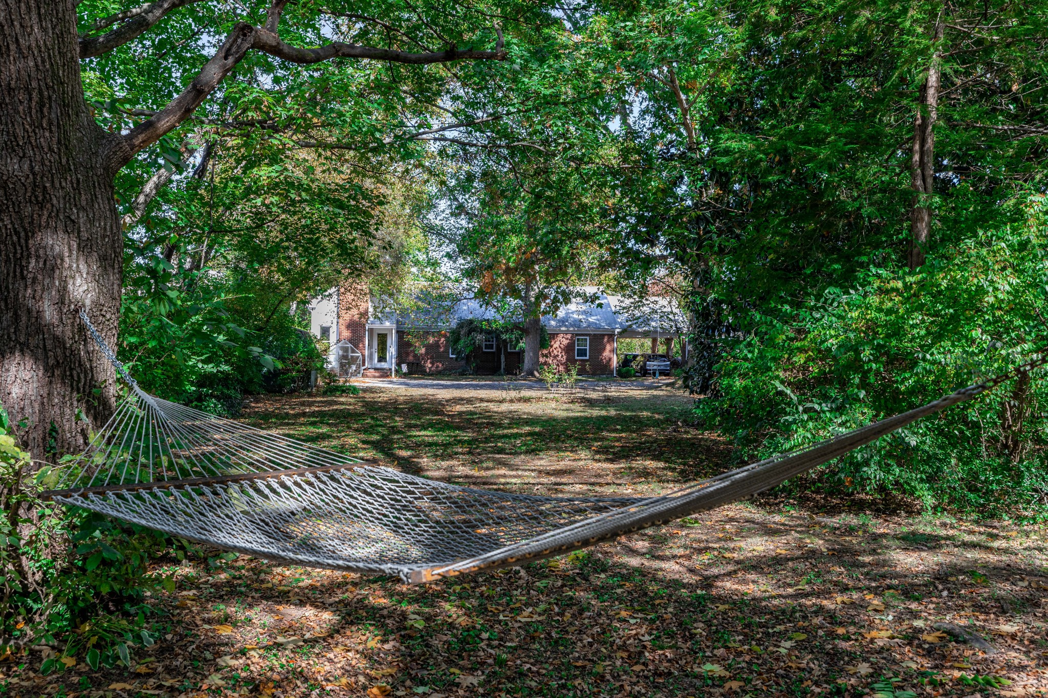 714 Murfreesboro Road Franklin, TN 37064 - Photo 31 of 46 a view of a backyard with large trees
