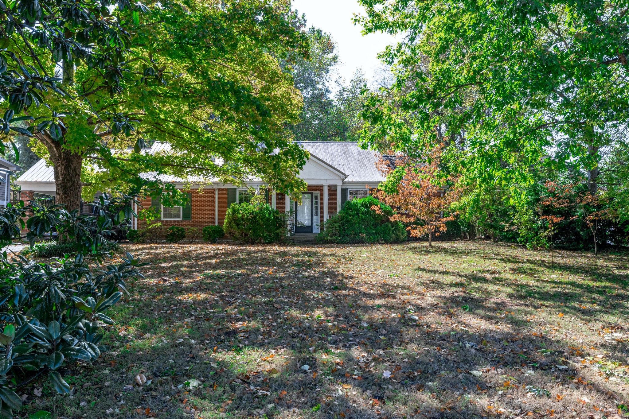 714 Murfreesboro Road Franklin, TN 37064 - Photo 32 of 46 a house with trees in front of it