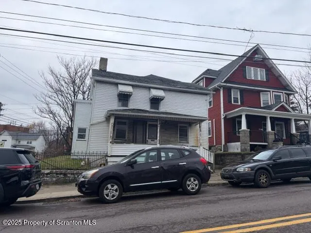 a car parked in front of a house