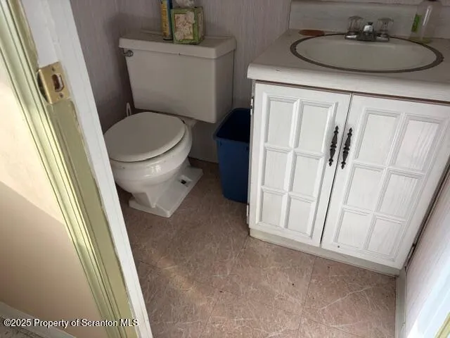 a bathroom with a toilet and a sink