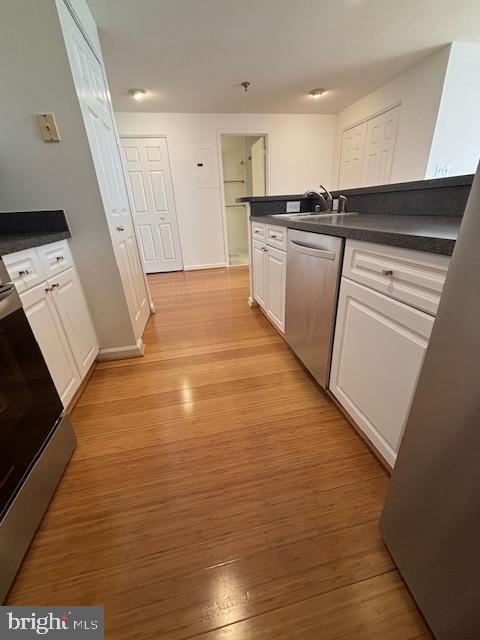 1312 Massachusetts Avenue Northwest, Unit 708 Washington, DC 20005 - Photo 25 of 34 a view of a kitchen with a sink and dishwasher stove top oven