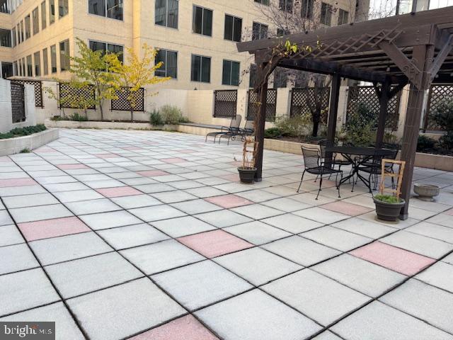 1312 Massachusetts Avenue Northwest, Unit 708 Washington, DC 20005 - Photo 31 of 34 a street view with tall buildings and a bench