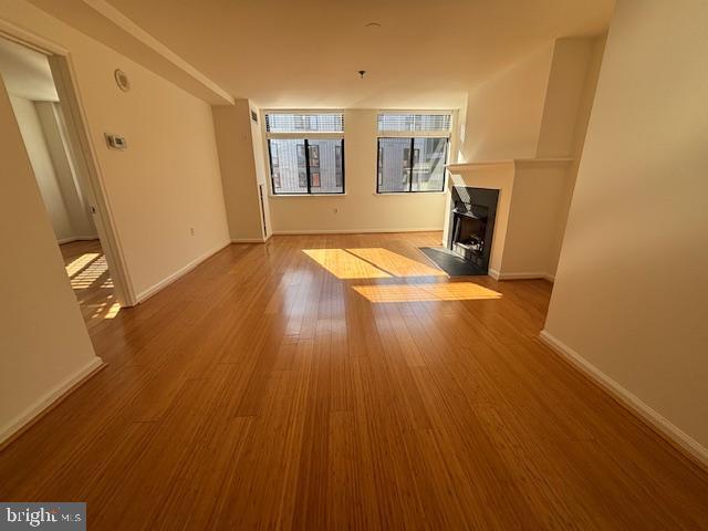 1312 Massachusetts Avenue Northwest, Unit 708 Washington, DC 20005 - Photo 8 of 34 a view of livingroom with hardwood floor and front door