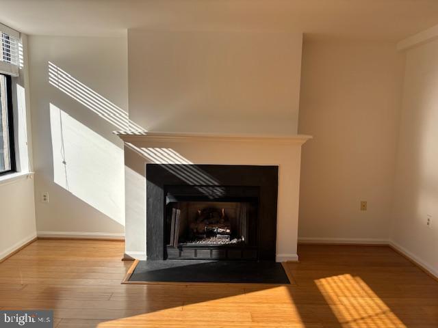 1312 Massachusetts Avenue Northwest, Unit 708 Washington, DC 20005 - Photo 9 of 34 a living room with furniture and a fireplace