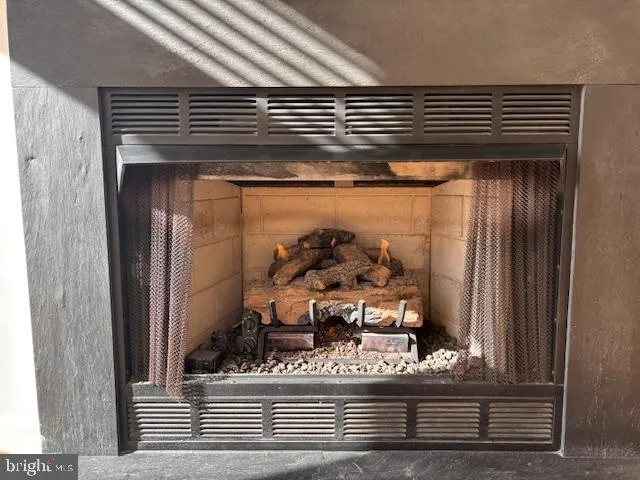 a view of a room with wooden floor and an entrance