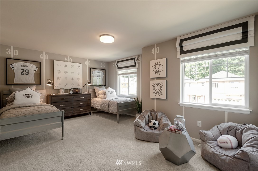 4110 235th Place Southeast, Unit 49 Bothell, WA 98021 - Photo 11 of 18 a bedroom with furniture and a large window