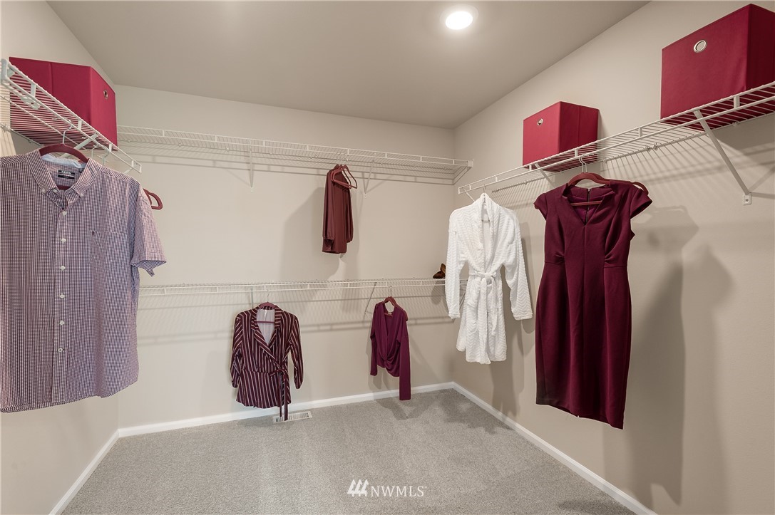 4110 235th Place Southeast, Unit 49 Bothell, WA 98021 - Photo 17 of 18 a view of walk in closet with clothes and shoes